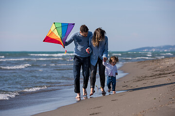 Image showing happy family enjoying vecation during autumn day