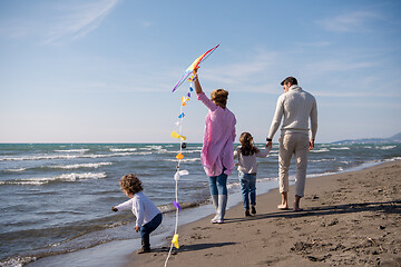 Image showing happy family enjoying vecation during autumn day