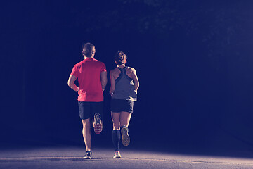 Image showing runners team on the night training