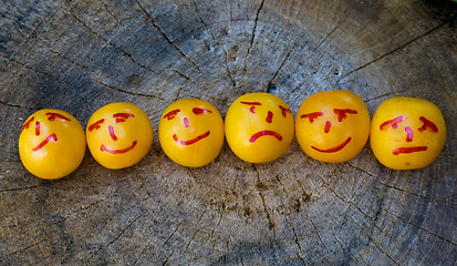 Image showing yellow plums like emoticons