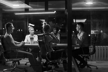 Image showing Multiethnic startup business team in night office