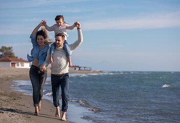 Image showing Young family enjoying vecation during autumn