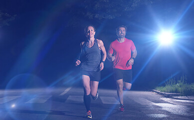 Image showing runners team on the night training