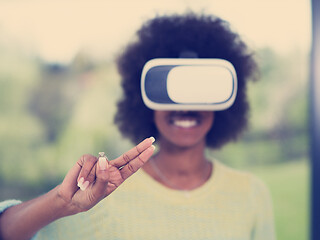 Image showing black woman using VR headset glasses of virtual reality