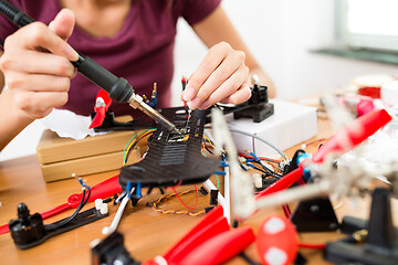 Image showing Welding on drone at home