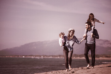 Image showing Young family enjoying vecation during autumn