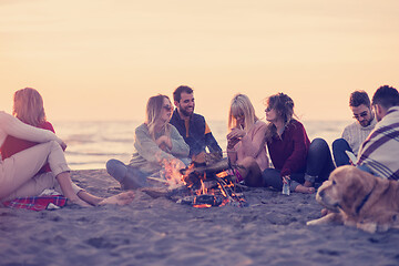 Image showing Friends having fun at beach on autumn day