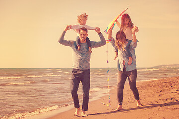 Image showing happy family enjoying vecation during autumn day