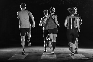 Image showing runners team on the night training