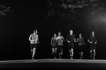 Image showing runners team on the night training