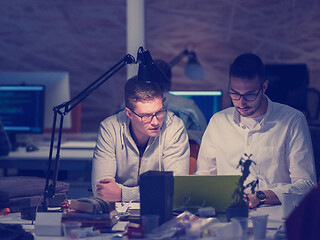 Image showing designers in the night startup office