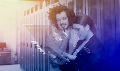 Image showing engineer showing working data center server room to female chief