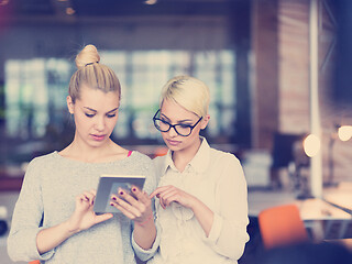 Image showing Pretty Businesswomen Using Tablet In Office Building during conf