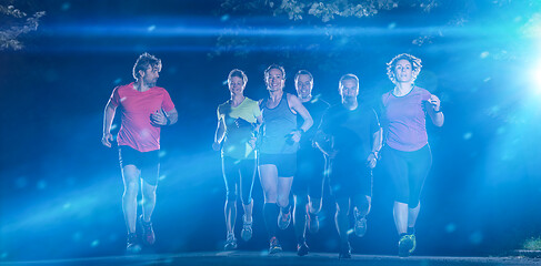 Image showing runners team on the night training