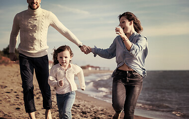 Image showing Young family enjoying vecation during autumn