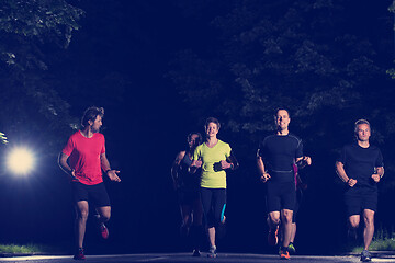 Image showing runners team on the night training