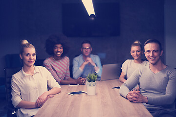 Image showing Multiethnic startup business team in night office