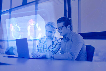 Image showing Two Business People Working With laptop in office