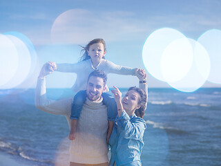 Image showing Young family enjoying vecation during autumn day