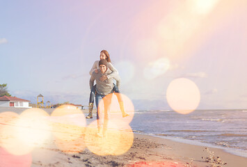 Image showing couple having fun at beach during autumn