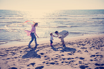 Image showing happy family enjoying vecation during autumn day