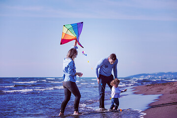 Image showing happy family enjoying vecation during autumn day