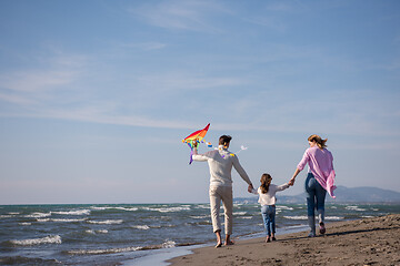 Image showing happy family enjoying vecation during autumn day