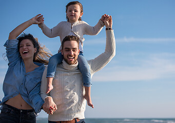 Image showing Young family enjoying vecation during autumn