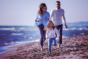 Image showing Young family enjoying vecation during autumn