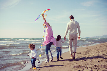 Image showing happy family enjoying vecation during autumn day