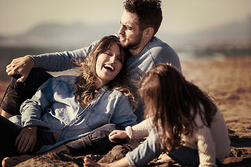 Image showing Young family enjoying vecation during autumn