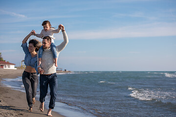 Image showing Young family enjoying vecation during autumn