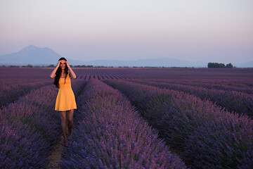 Image showing woman in yellow dress at lavender field