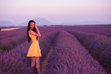 Image showing woman in yellow dress at lavender field