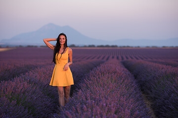 Image showing woman in yellow dress at lavender field