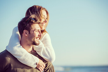 Image showing couple having fun at beach during autumn