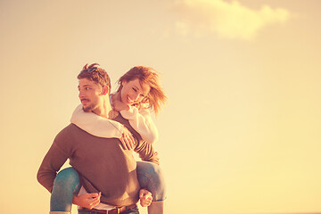 Image showing couple having fun at beach during autumn