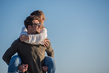 Image showing couple having fun at beach during autumn