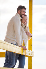 Image showing young couple drinking beer together at the beach