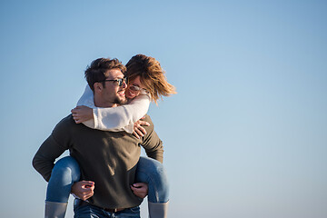 Image showing couple having fun at beach during autumn