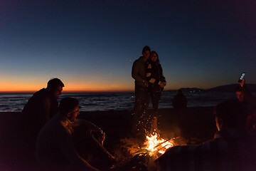 Image showing Friends having fun at beach on autumn day