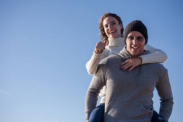 Image showing couple having fun at beach during autumn