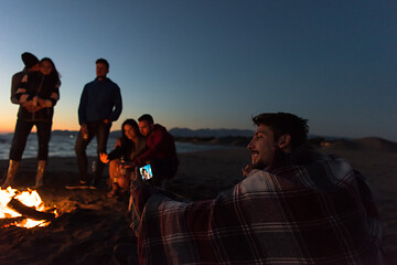 Image showing Friends having fun at beach on autumn day