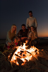 Image showing Friends having fun at beach on autumn day