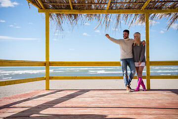 Image showing Couple chating and having fun at beach bar