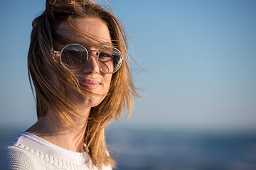 Image showing Young woman enjoying the warm autumn day