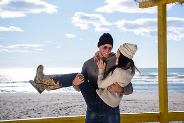 Image showing Couple chating and having fun at beach bar