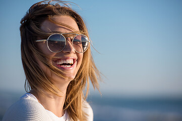 Image showing Young woman enjoying the warm autumn day