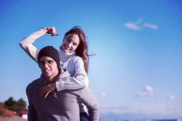 Image showing couple having fun at beach during autumn