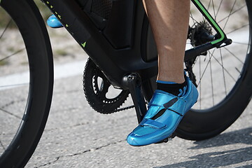 Image showing closeup of triathlon athlete riding bike